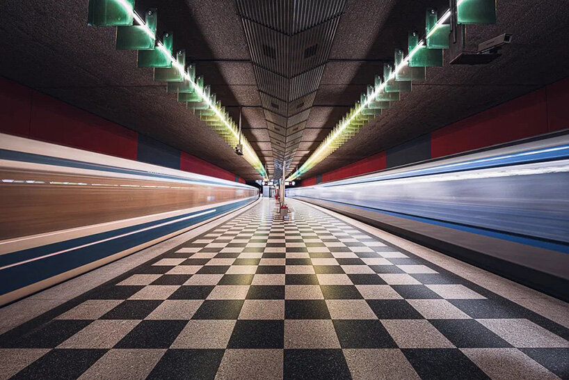 european metro stations unfold as mirrored worlds of calm in thibault drutel's photo series