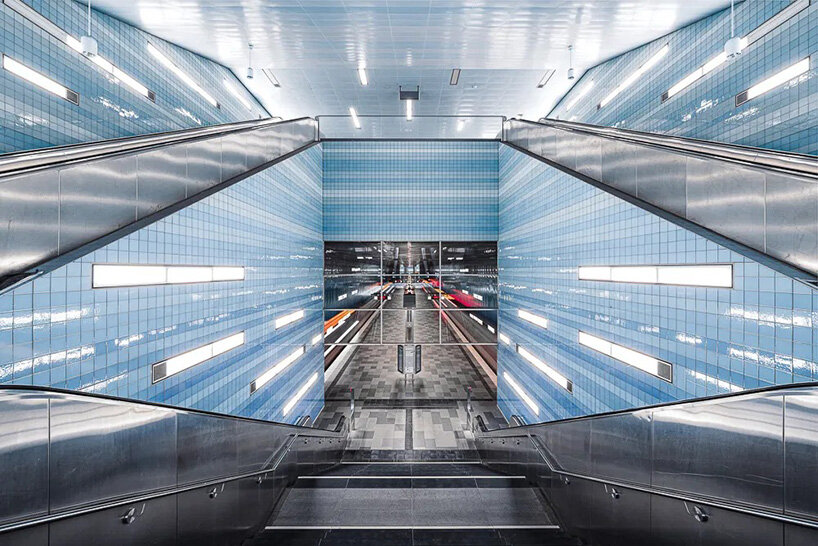 european metro stations unfold as mirrored worlds of calm in thibault drutel's photo series
