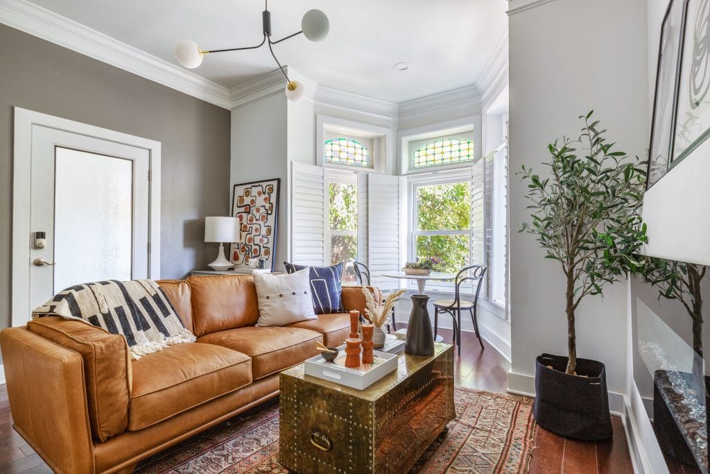 Modern apartment decor in a living room by Decorilla designer, Megan W.