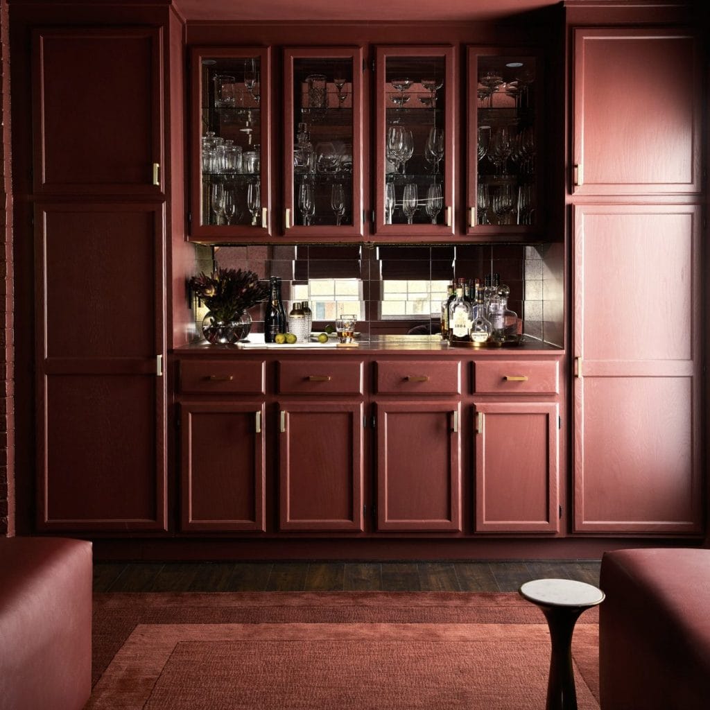 Monochromatic pub room featuring modern British style by Decorilla designer, Dorian R.