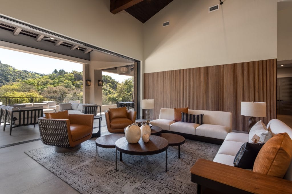 Natural home decor in a contemporary earthy living room by Decorilla designer, Sadi M.