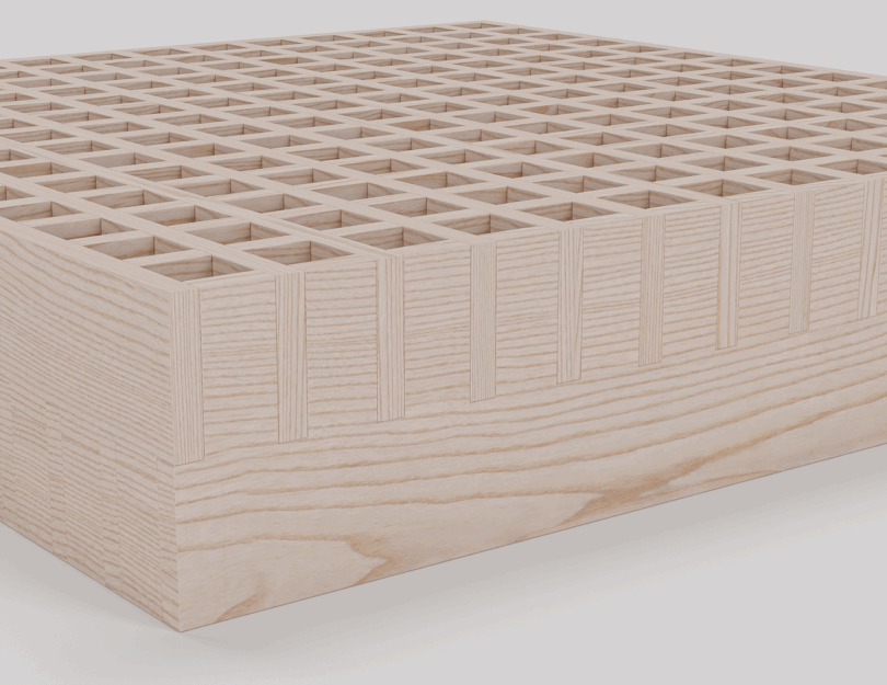 A beige, square grid structure with evenly spaced square holes, positioned at an angle on a white background