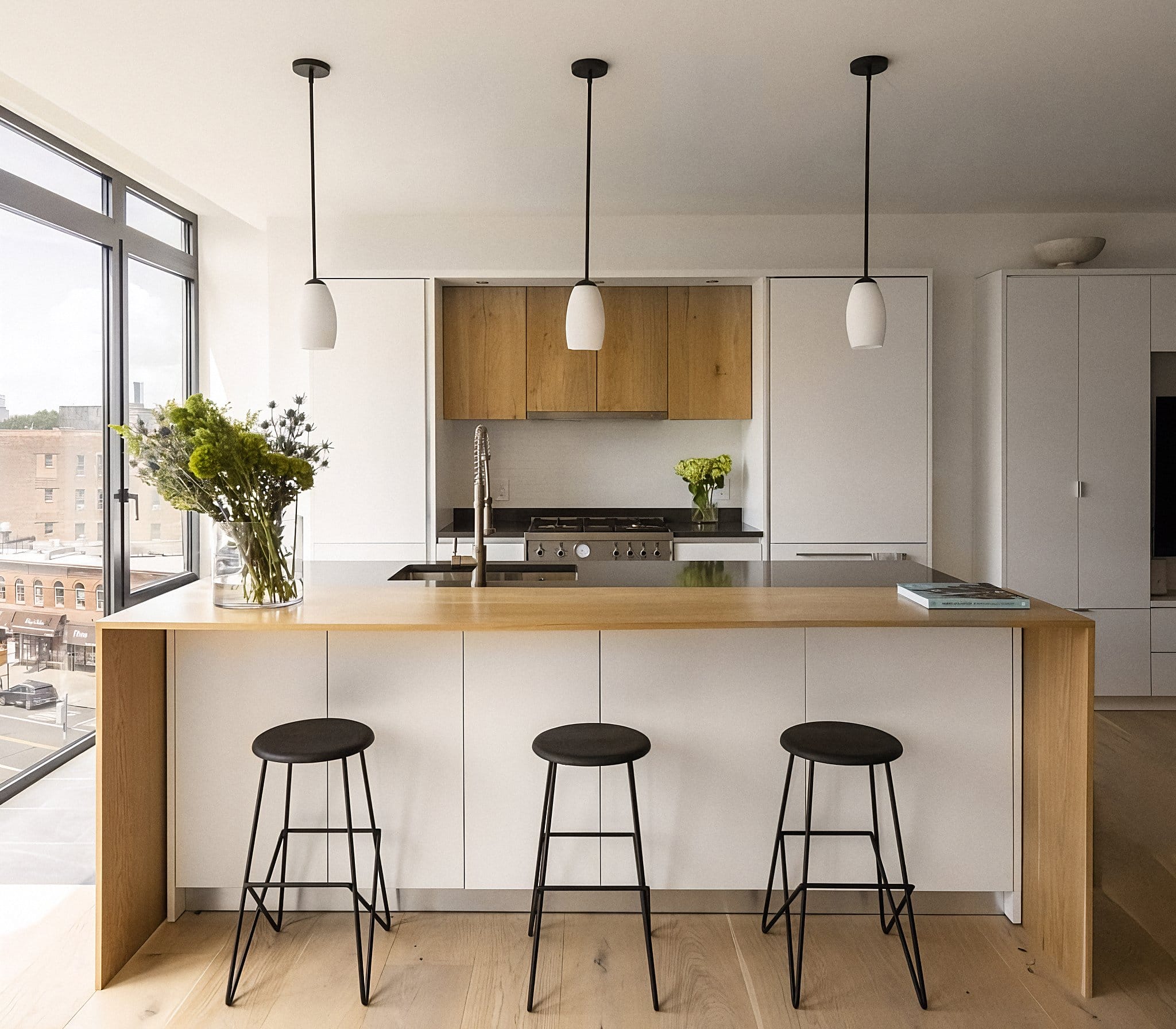 Small modular kitchen decor trend in a condo by Decorilla designer, Jonathan K. 