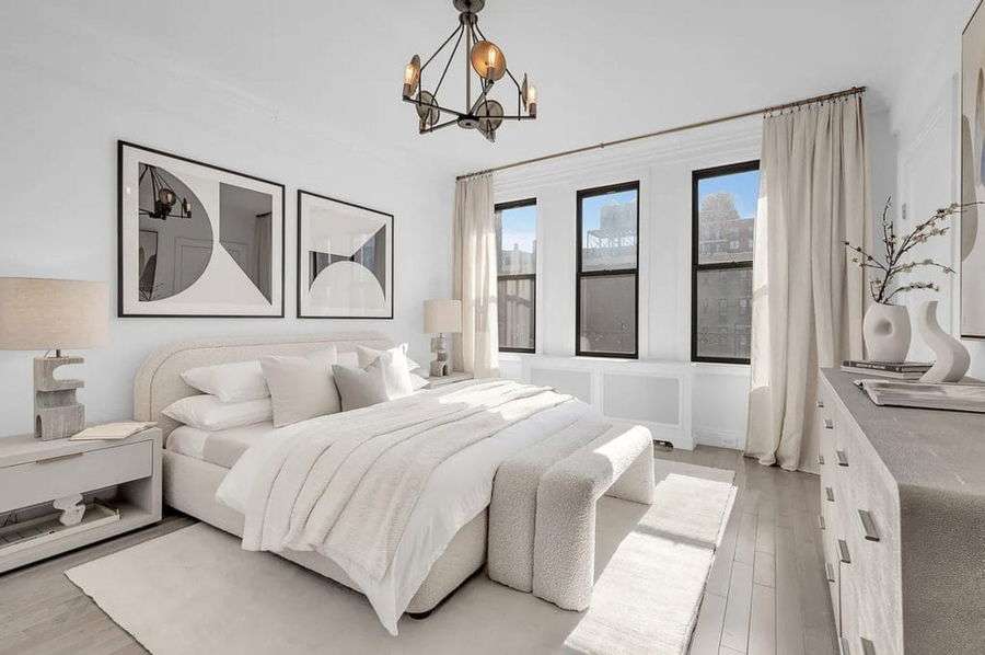 Modern bedroom bed placement by Decorilla designer, Leanna S.