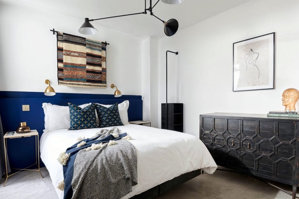 Contemporary bedroom with vintage statement wall decor by DECORILLA designer, Sarah R. 