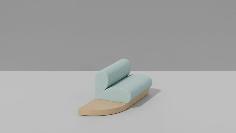A minimalist bench with candy-colored light blue cylindrical cushions on a light wood base, set against a gray background.