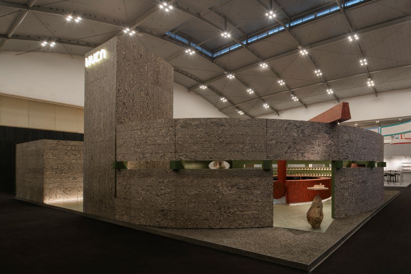 circular timber pavilion with voids and slits displays variety of veneer textures and finishes