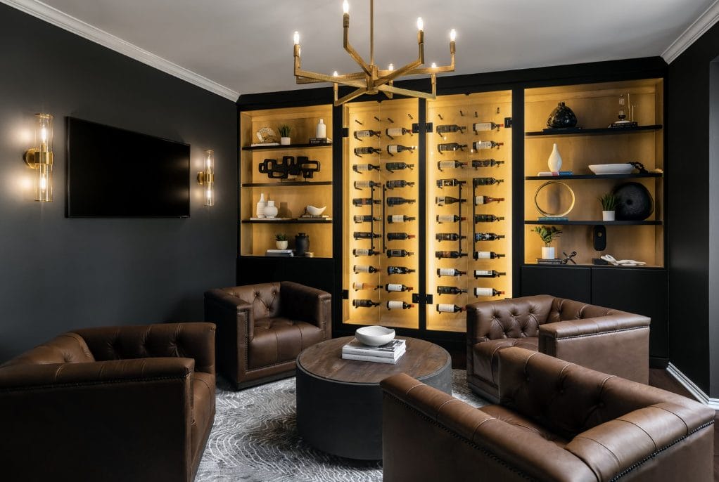 Modern dark academia inspired lounge by Decorilla designer, Kaitlyn B. 