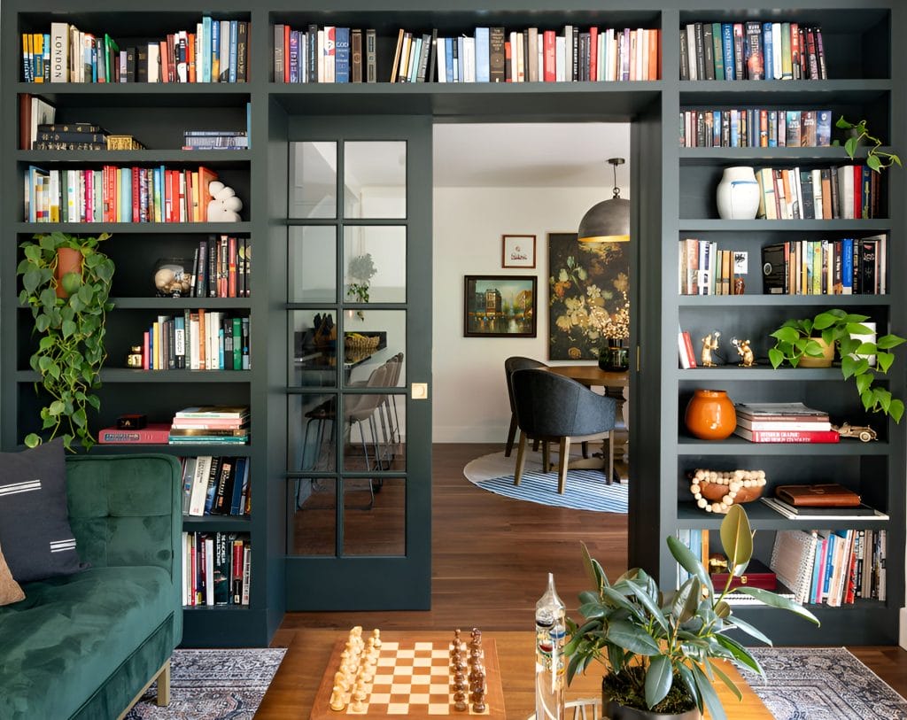 A timeless library in a modern take on the dark academia style by Decorilla designer Sadi M