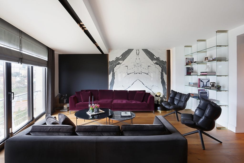 Modern masculine living room interior design with colorful accents, by Decorilla designer, Meric S.
