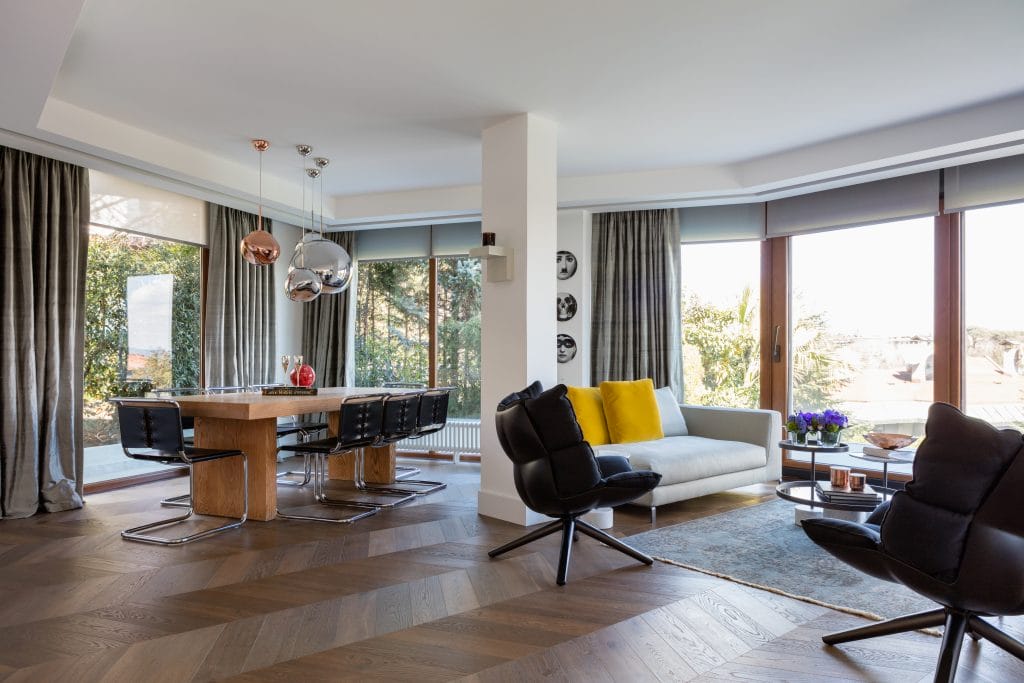 Masculine living room interior design with colorful accents, by Decorilla designer, Meric S.
