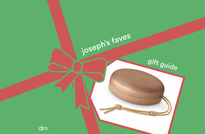 A gold portable speaker on a green background with a red ribbon graphic and the text
