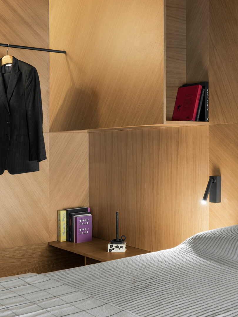 angled partial view of modern bedroom with wood walls