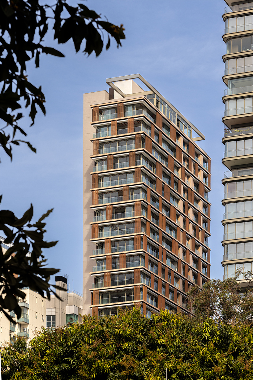 kinetic wooden panels run across residential tower's facade by perkins&will in são paulo