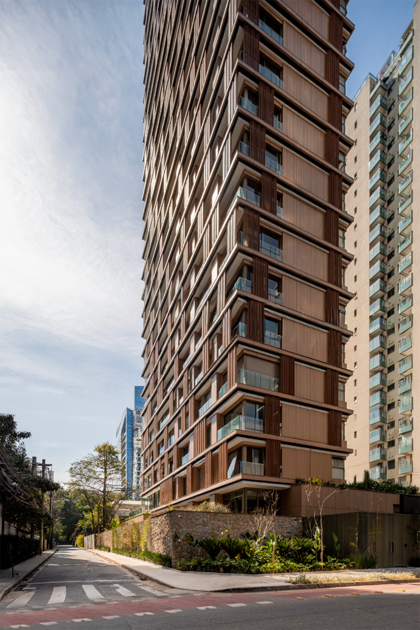 kinetic wooden panels run across residential tower's facade by perkins&will in são paulo