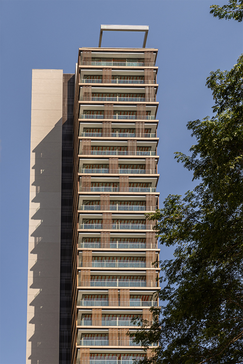 kinetic wooden panels run across residential tower's facade by perkins&will in são paulo