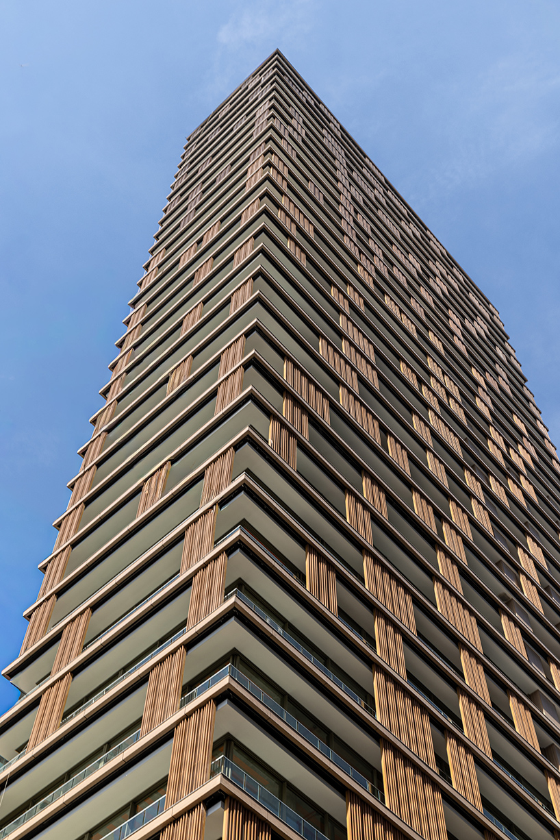 kinetic wooden panels run across residential tower's facade by perkins&will in são paulo