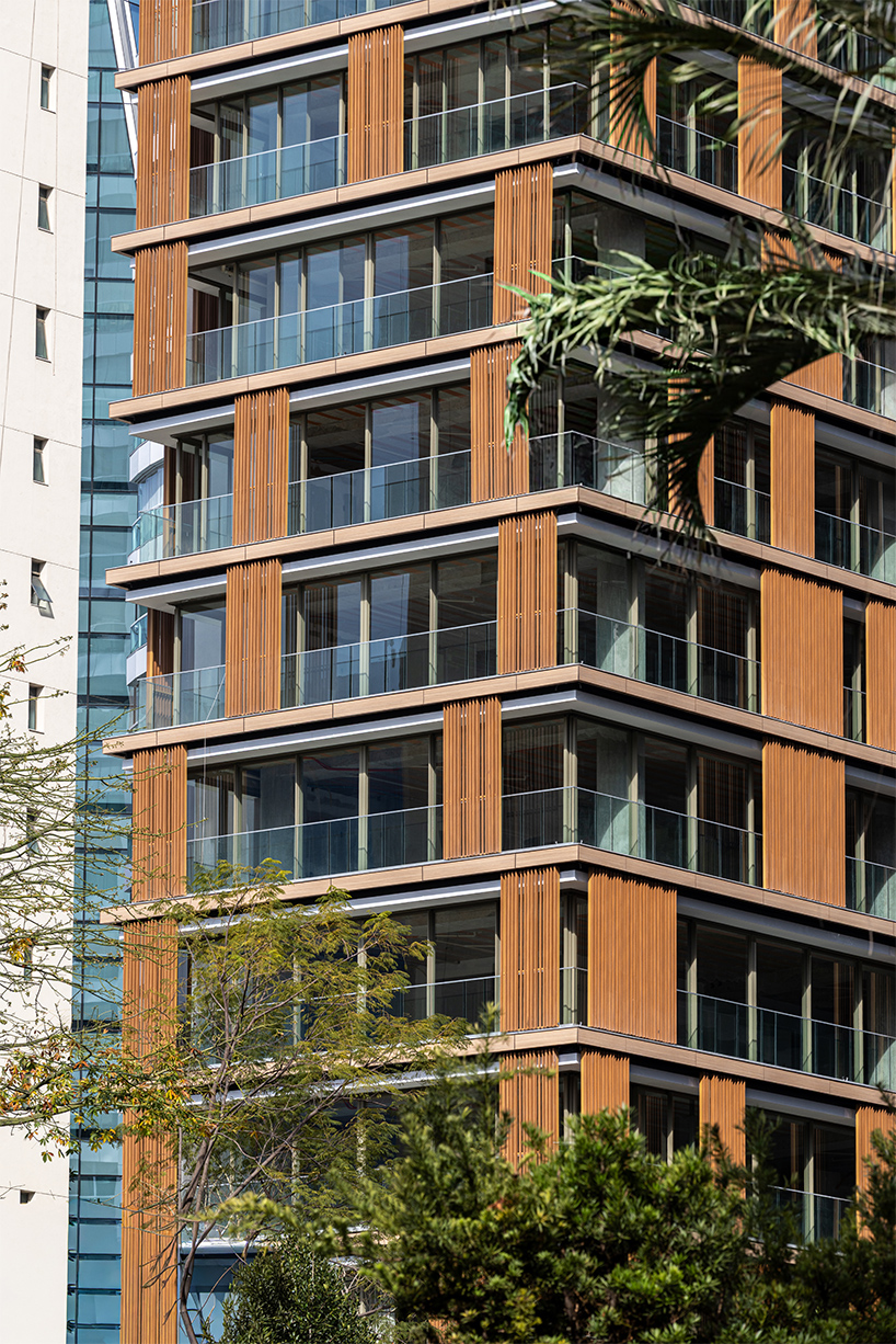 kinetic wooden panels run across residential tower's facade by perkins&will in são paulo