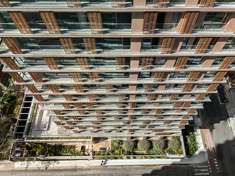 kinetic wooden panels run across residential tower's facade by perkins&will in são paulo
