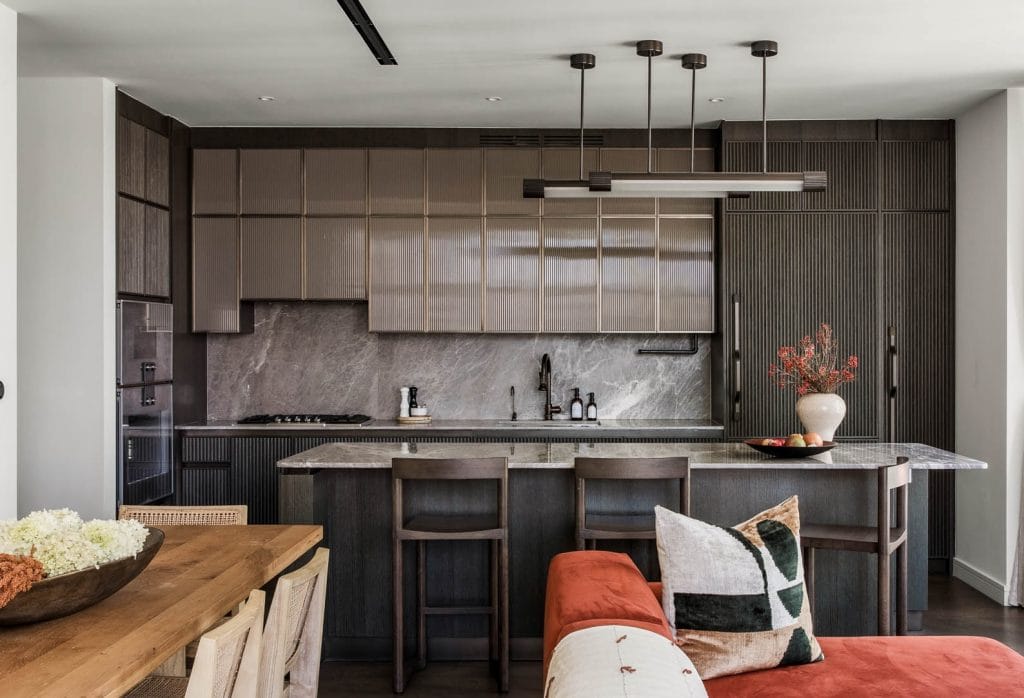 Glass accents in an interior by Decorilla designer, Jonathan K., -kitchen cabinet trends 2026