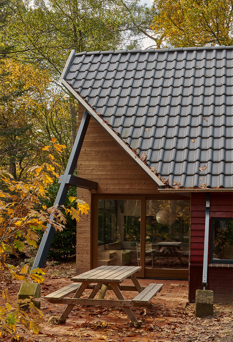 diagonally cut A-frame roof revives dutch holiday home by kumiki