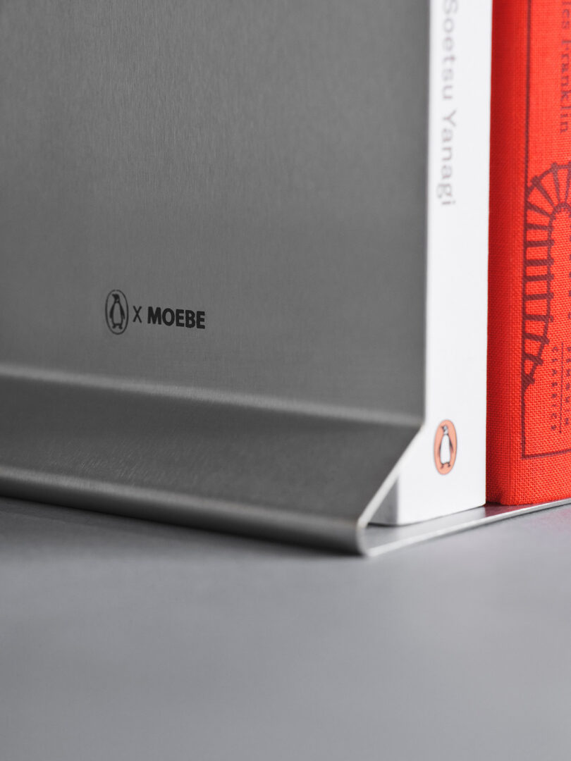 Close-up of a metal bookend branded 