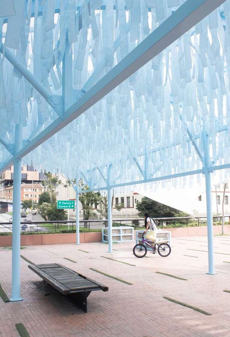 blue fabric fragments dance with the wind on modular cultural pavilion in colombia