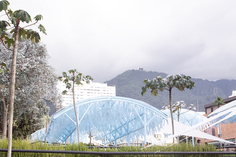 blue fabric fragments dance with the wind on modular cultural pavilion in colombia