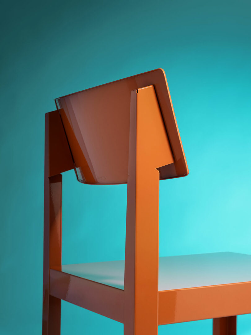 Orange modern chair with an angled backrest, shown against a gradient blue background. The chair has a glossy finish and minimalist design.