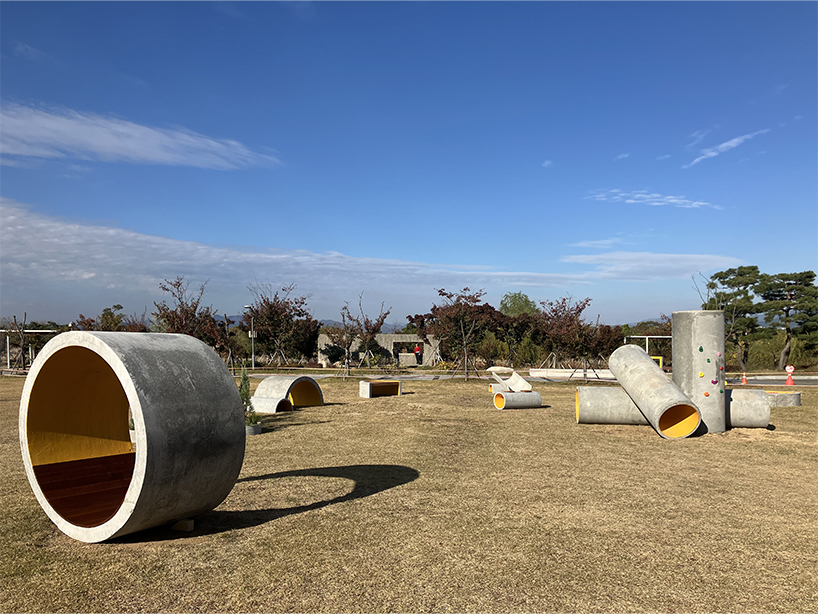 concrete utopia transforms discarded construction pipes into playground in south korea