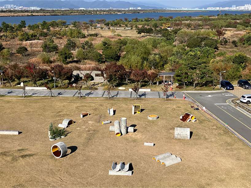 concrete utopia transforms discarded construction pipes into playground in south korea