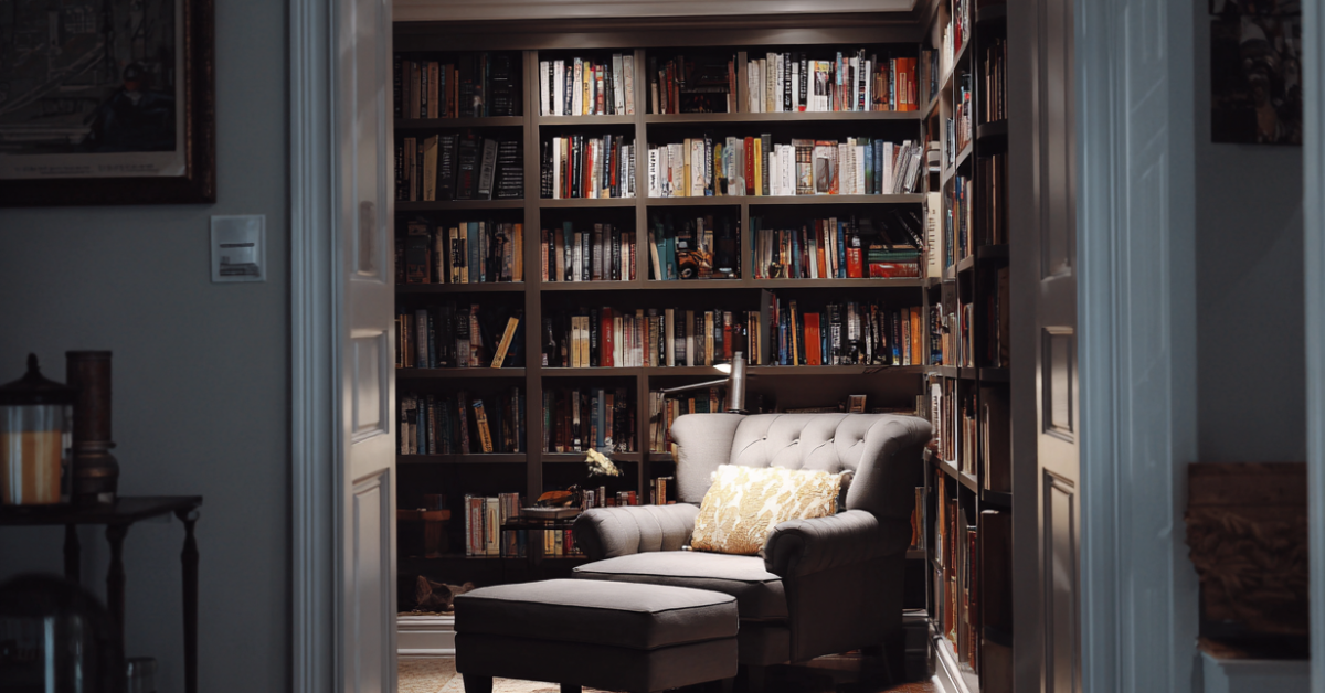 Cinematic shot of a well-lit home reading nook exemplifying the "librarycore" vibe of a home.