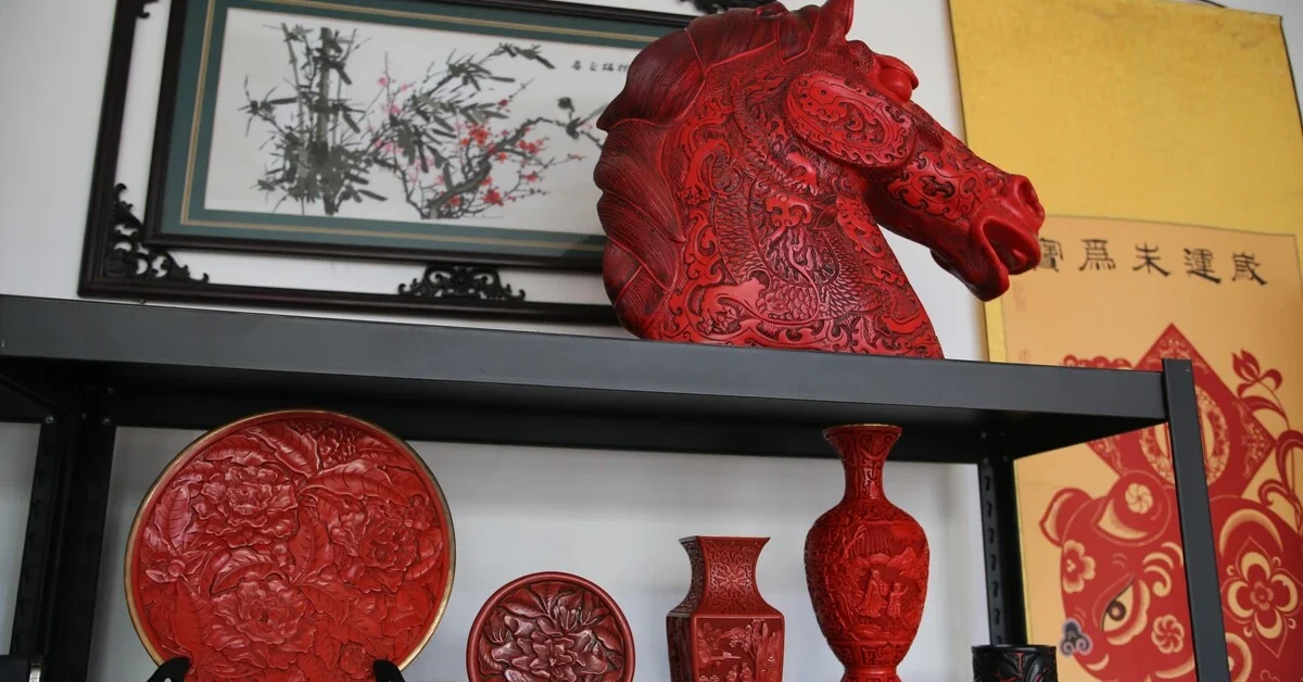 Carved lacquer artworks including a horse's head are displayed at Zhu Jiang's studio in Gu'an, north China's Hebei Province, May 30, 2024.
