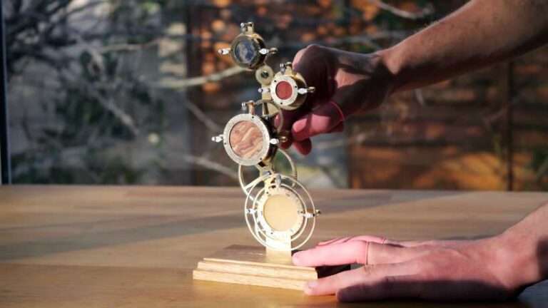 mechanical clock with rotating discs can tell what time it is on other planets