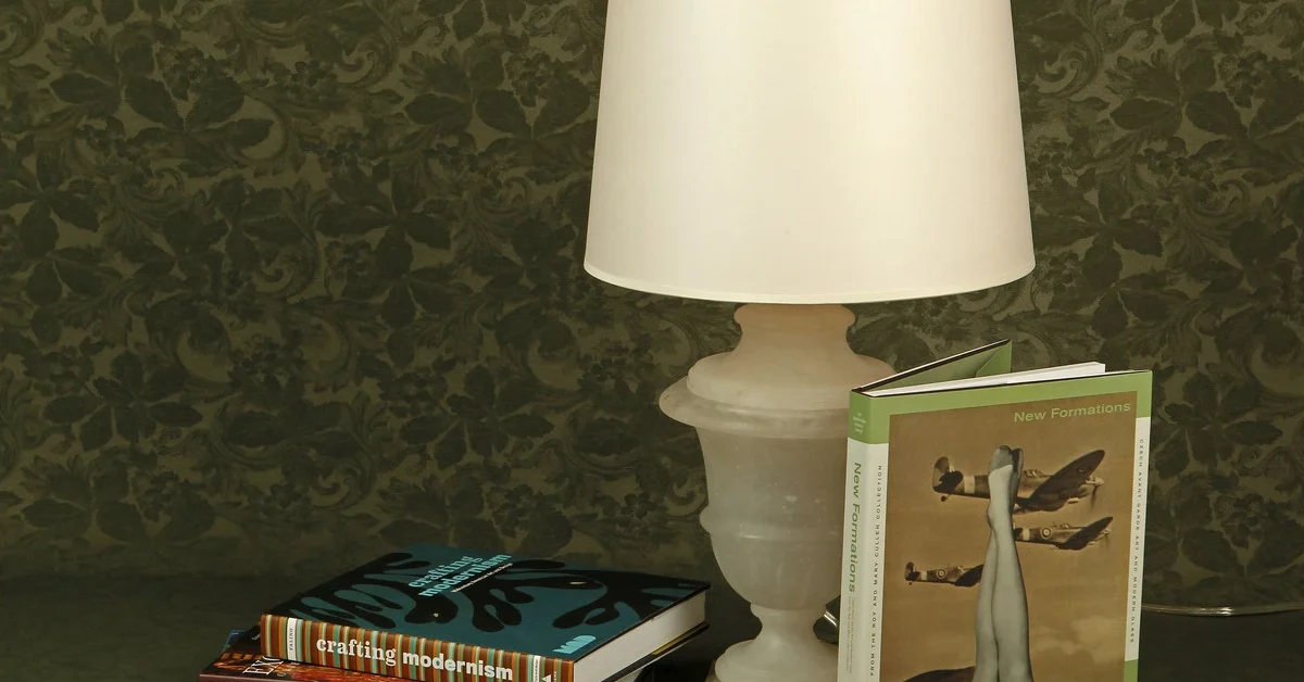 A selection of books with a lamp from Boxwood Tuesday, Dec. 20, 2011, in Houston. 
