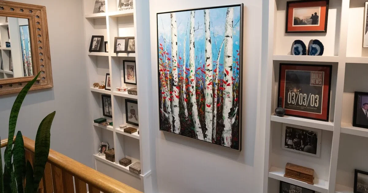 Unframed art used as a centerpiece in display. 