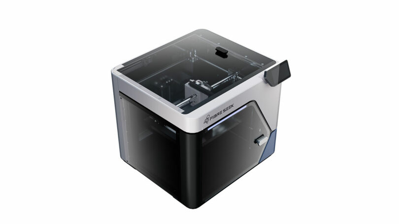 A modern tabletop 3D printer, the FibreSeeker, features a transparent lid and door, displaying the enclosed printing chamber and sleek control panel on the side.