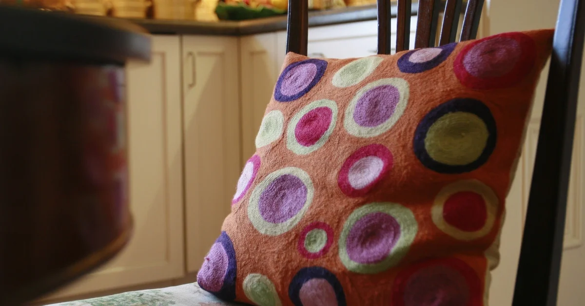 A fun seat cushion on a kitchen chair.