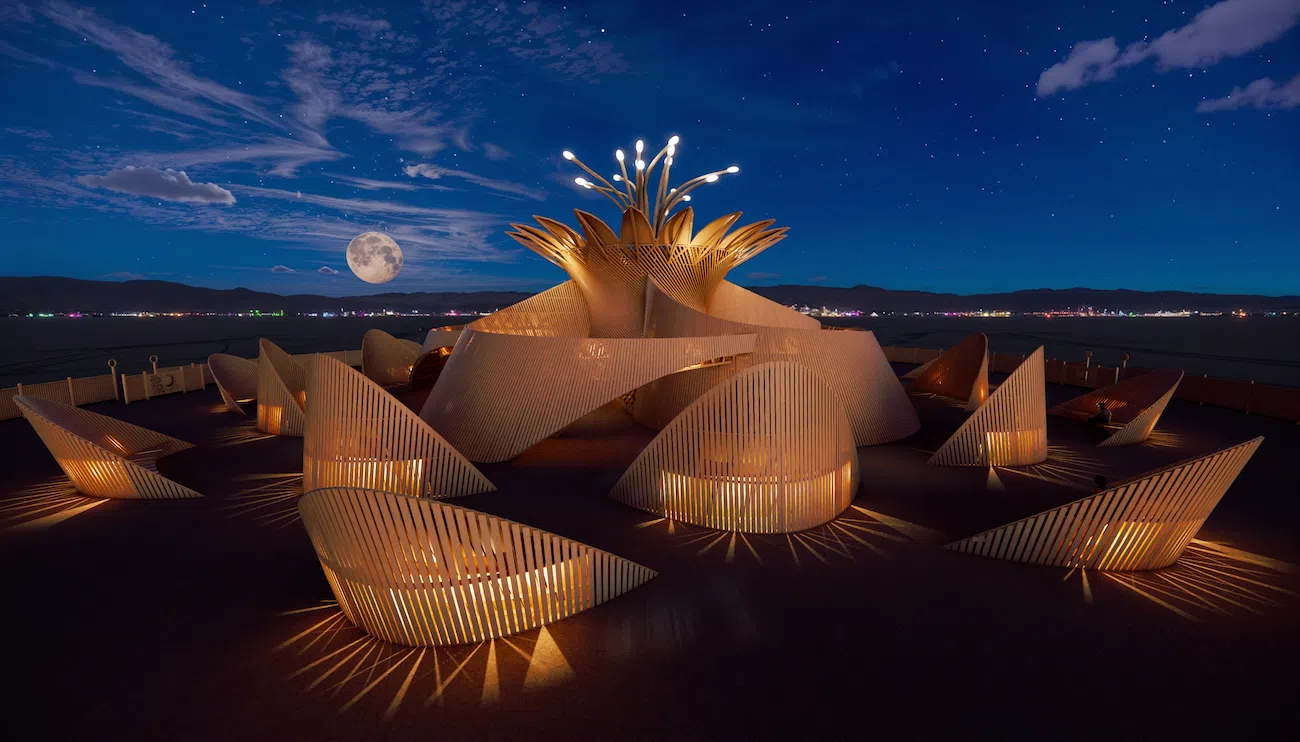 Temple of the Moon at Burning Man 2026 with petal-shaped timber walls and central flower structure at night.