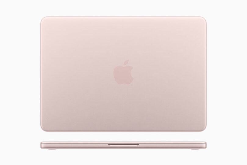 Closed rose gold Apple MacBook viewed from above, showcasing the iconic Apple logo centered on the lid against a plain white background.