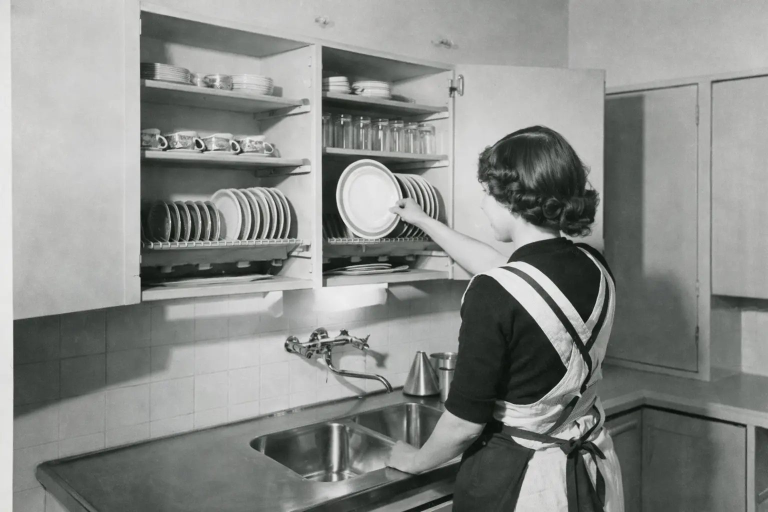 A black and white image of an old Finnish dish drying rack "astiankuivauskaappi"