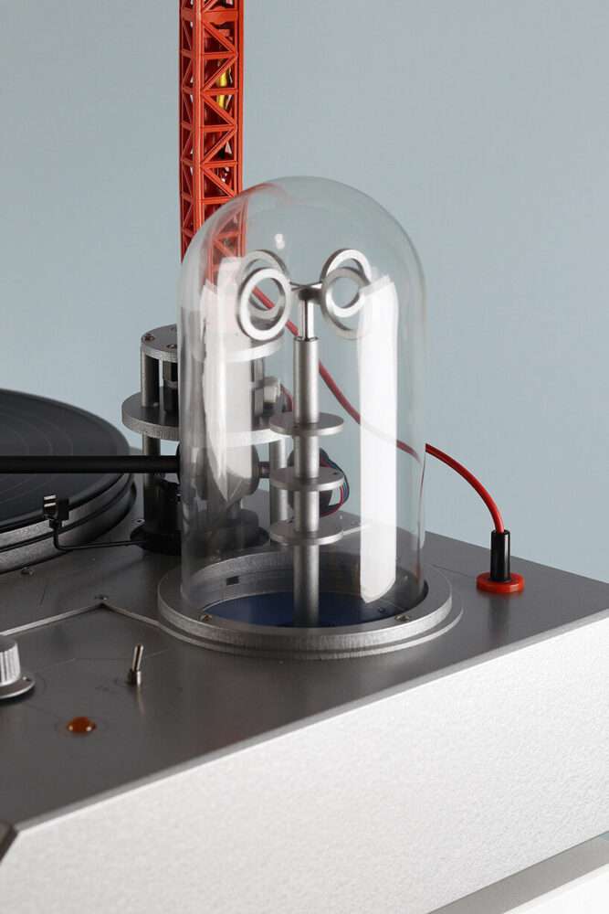 a bright red crane drives the needle in love hultén’s reimagined vinyl player