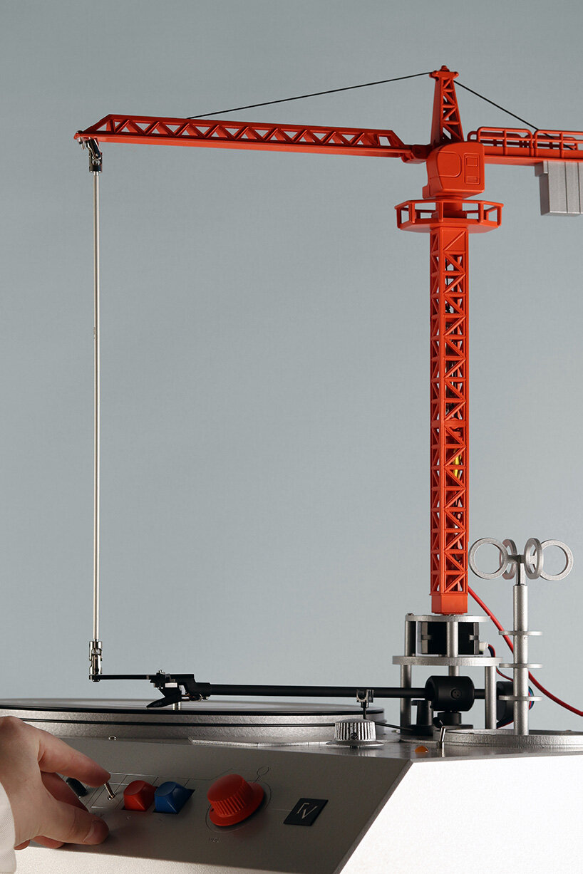 a bright red crane drives the needle in love hult&eacute;n's reimagined vinyl player - 3