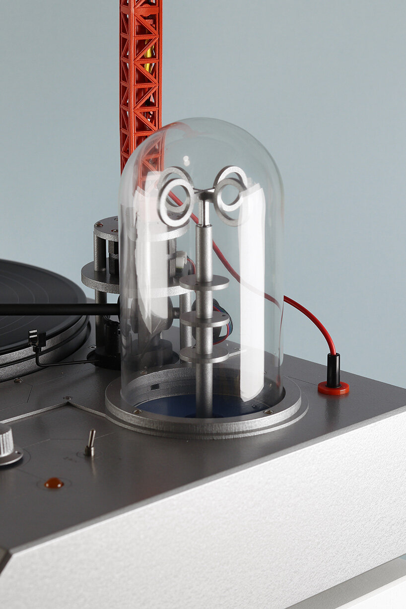 a bright red crane drives the needle in love hult&eacute;n's reimagined vinyl player - 5
