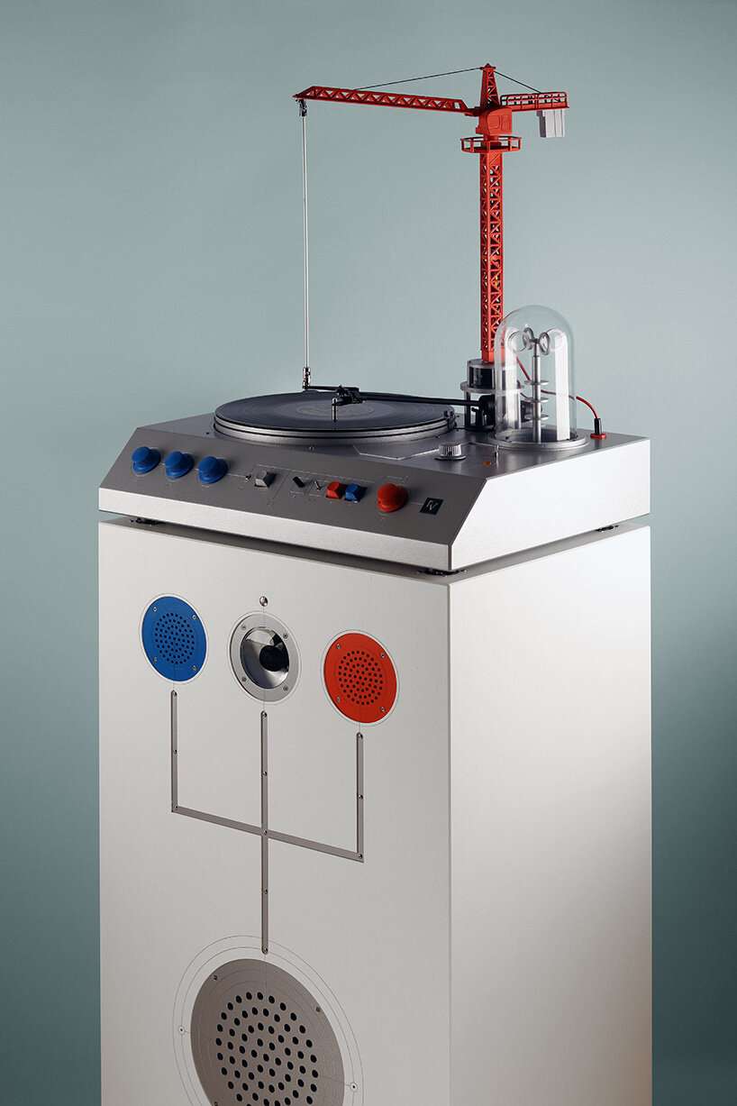 a bright red crane drives the needle in love hult&eacute;n's reimagined vinyl player - 1