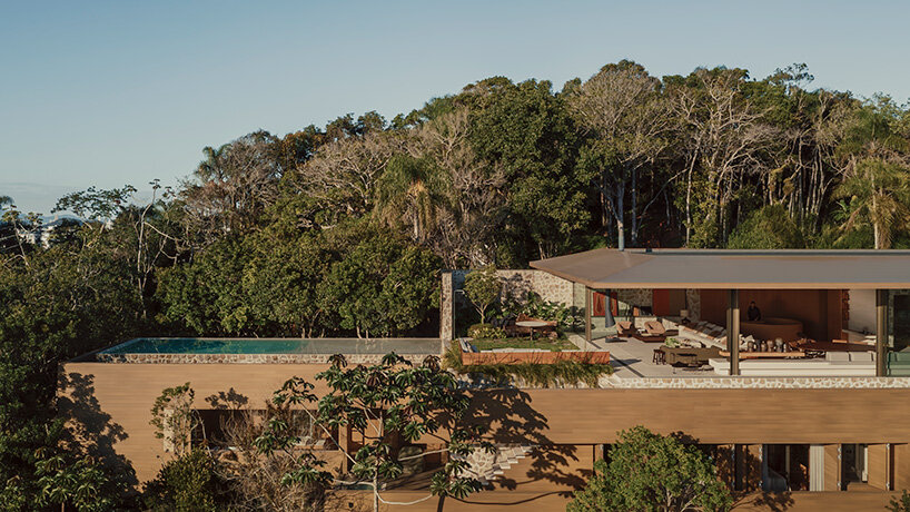 arthur casas adapts speculative structure into wood-lined coastal house in brazil - 2