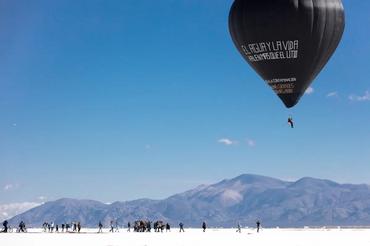 Tom&aacute;s SaracenoFly with Aerocene Pacha, Salinas Grandes and Laguna de Guayatayoc, northern Argentina, 2020, floating with the message written by the indigenous communities of Salinas Grandes and Laguna de Guayatayoc, Jujuy, Argentina: "Water and Life are Worth More than Lithium", 2020. Human Solar Free-Flight for Aerocene as part of "Connect, BTS", curated by DaeHyung Lee. Image courtesy of the Aerocene Foundation. Licensed under CC-SA 4.0 by Aerocene Foundation. &copy; Photography by Studio Tom&aacute;s Saracen