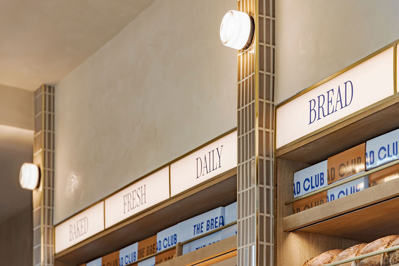 Illuminated bakery signage displays the words 
