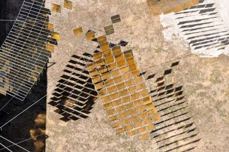 kinetic mirrored installation in portugal by moradavaga evokes a shoal of golden fish