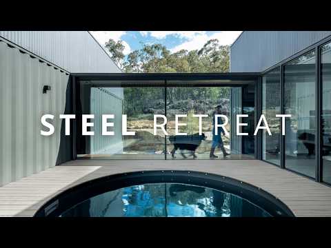 A Shipping Container Home Shaped by Rock and Water